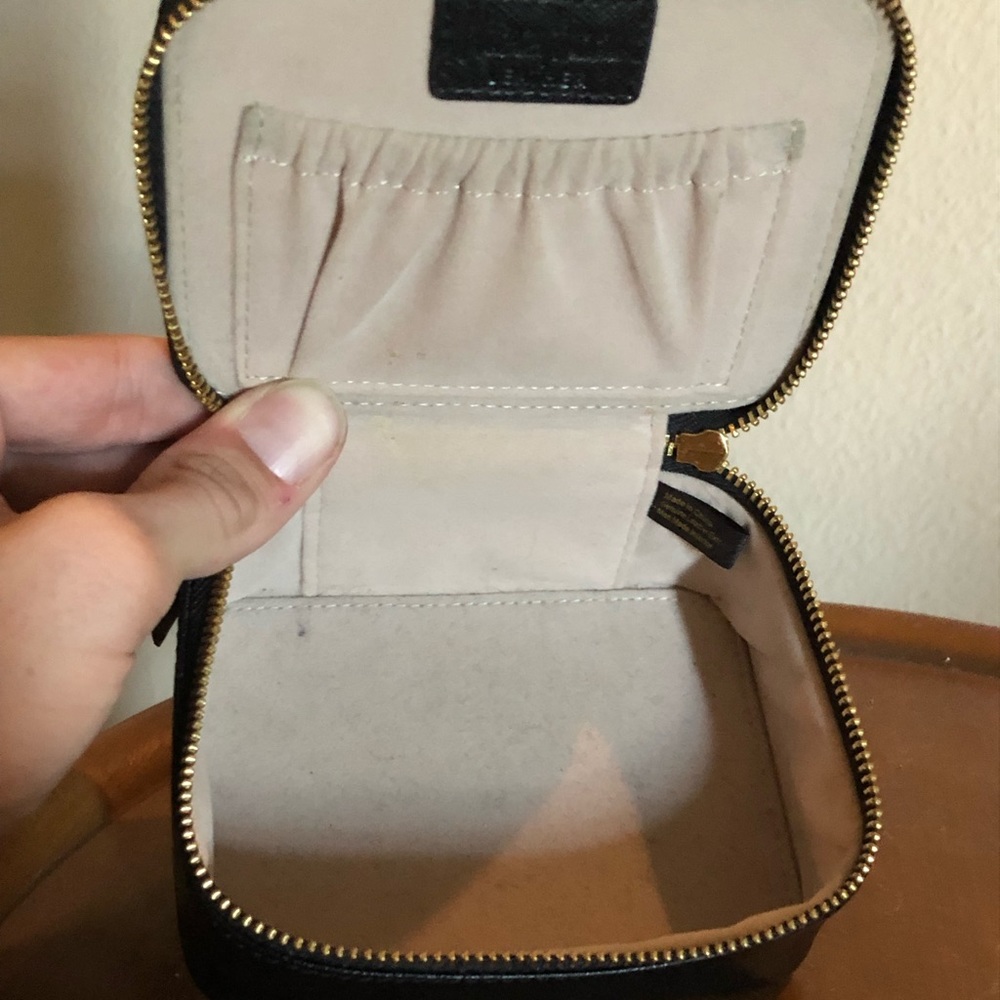 Neiman Marcus black leather pill box.With dividers